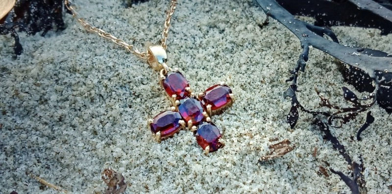 Agape cross Pyrope Garnets set in yellow Gold