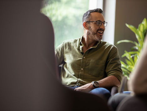 Image of smiling male wearing glasses