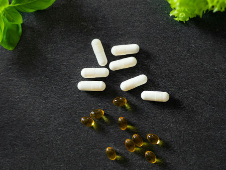 A bunch of pills sitting on top of lettuce