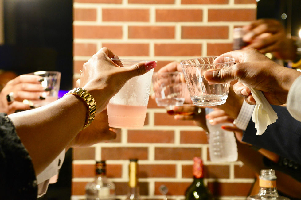Raising glasses at a social event