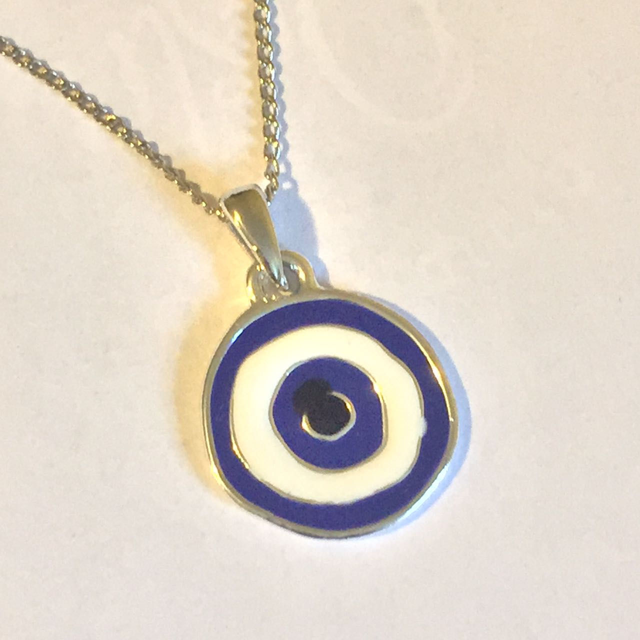 Corrente  com pingente de olho grego