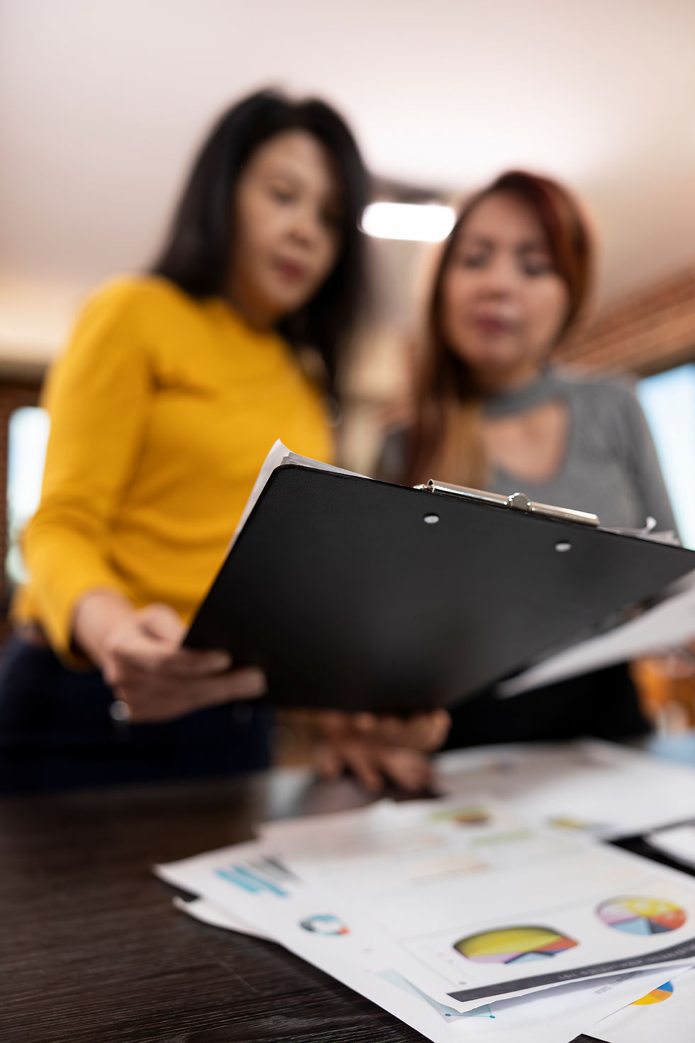 Two professionals discussing ai adoption and business outcomes