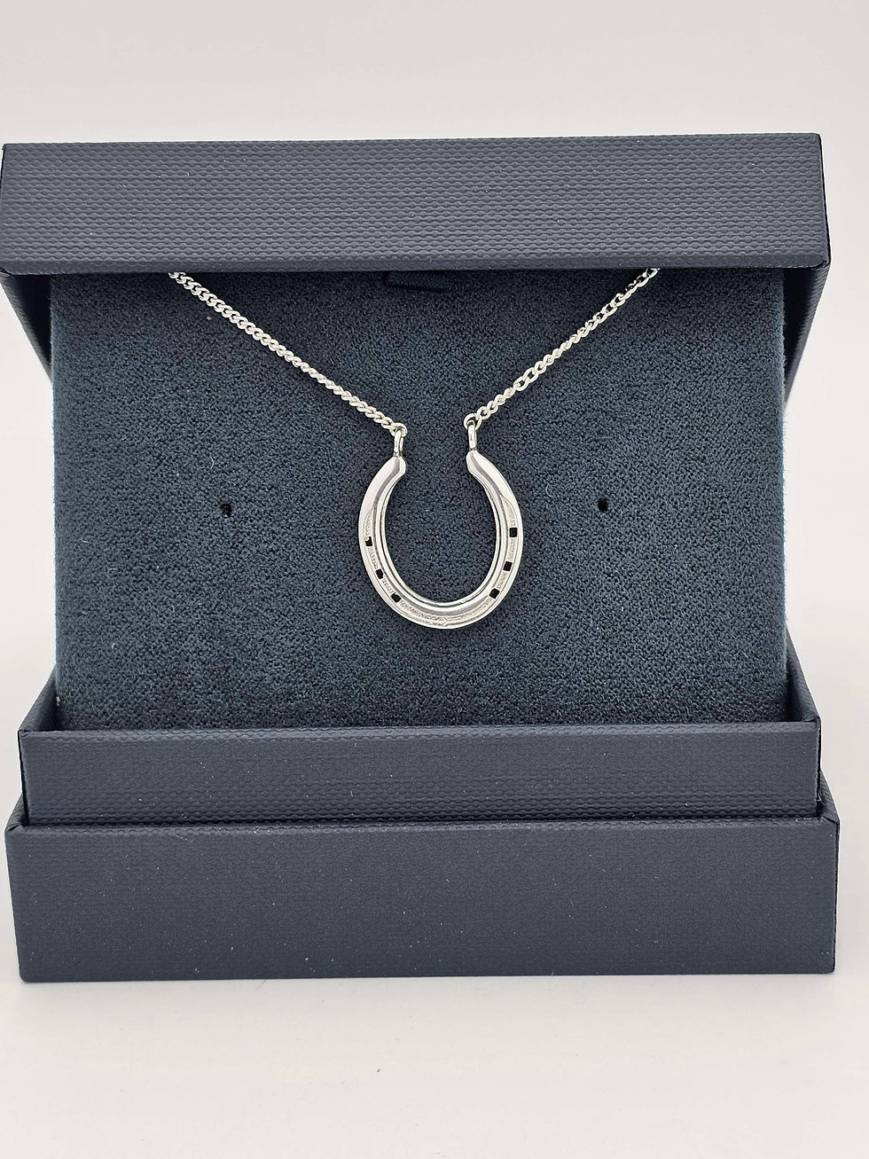 Thumbnail: Silver horse shoe pendant. Equestrian jewellery and keepsakes designed and made in the UK by Heart Horse.