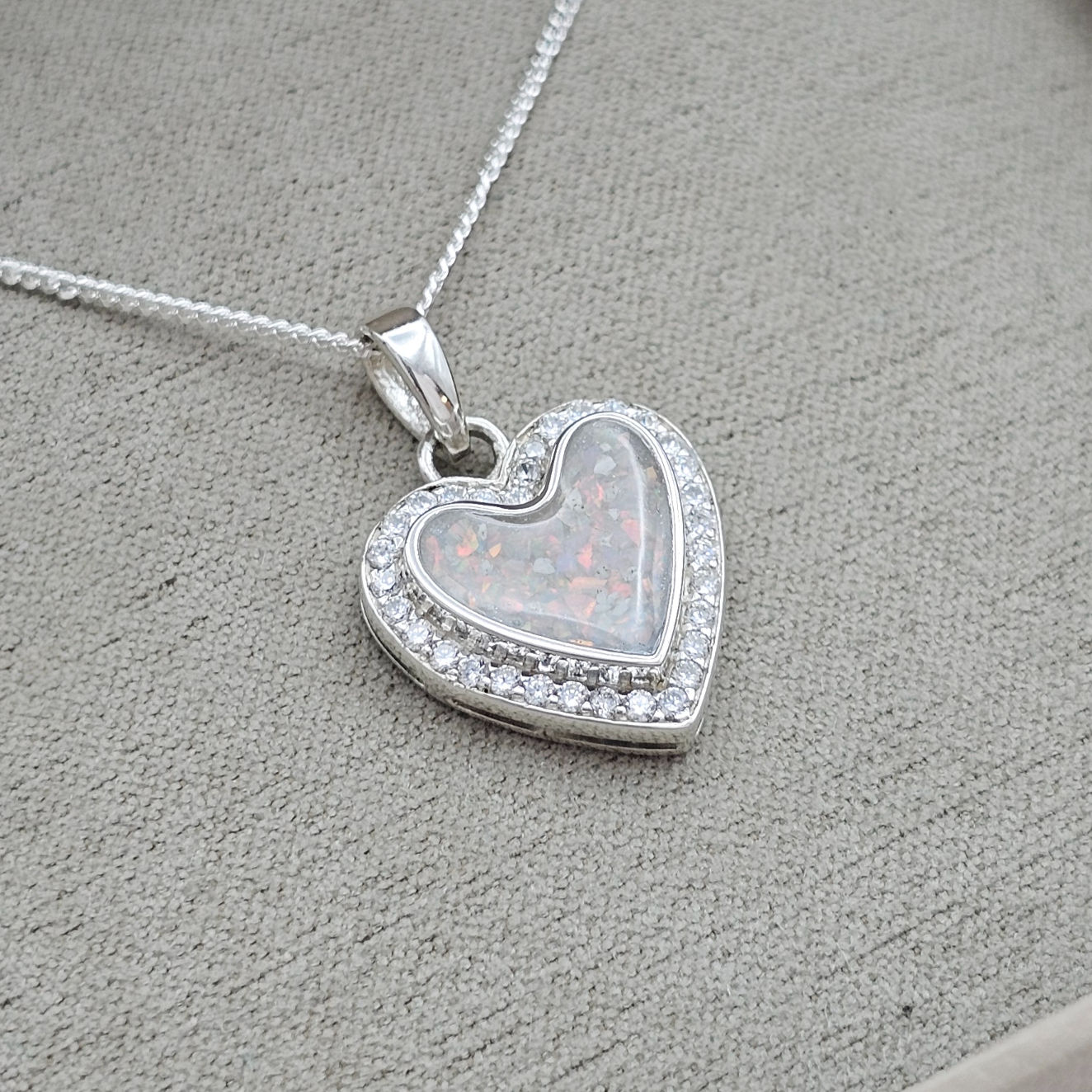 Beautiful silver and cubic zirconia memorial necklace for cremation ashes and hair.