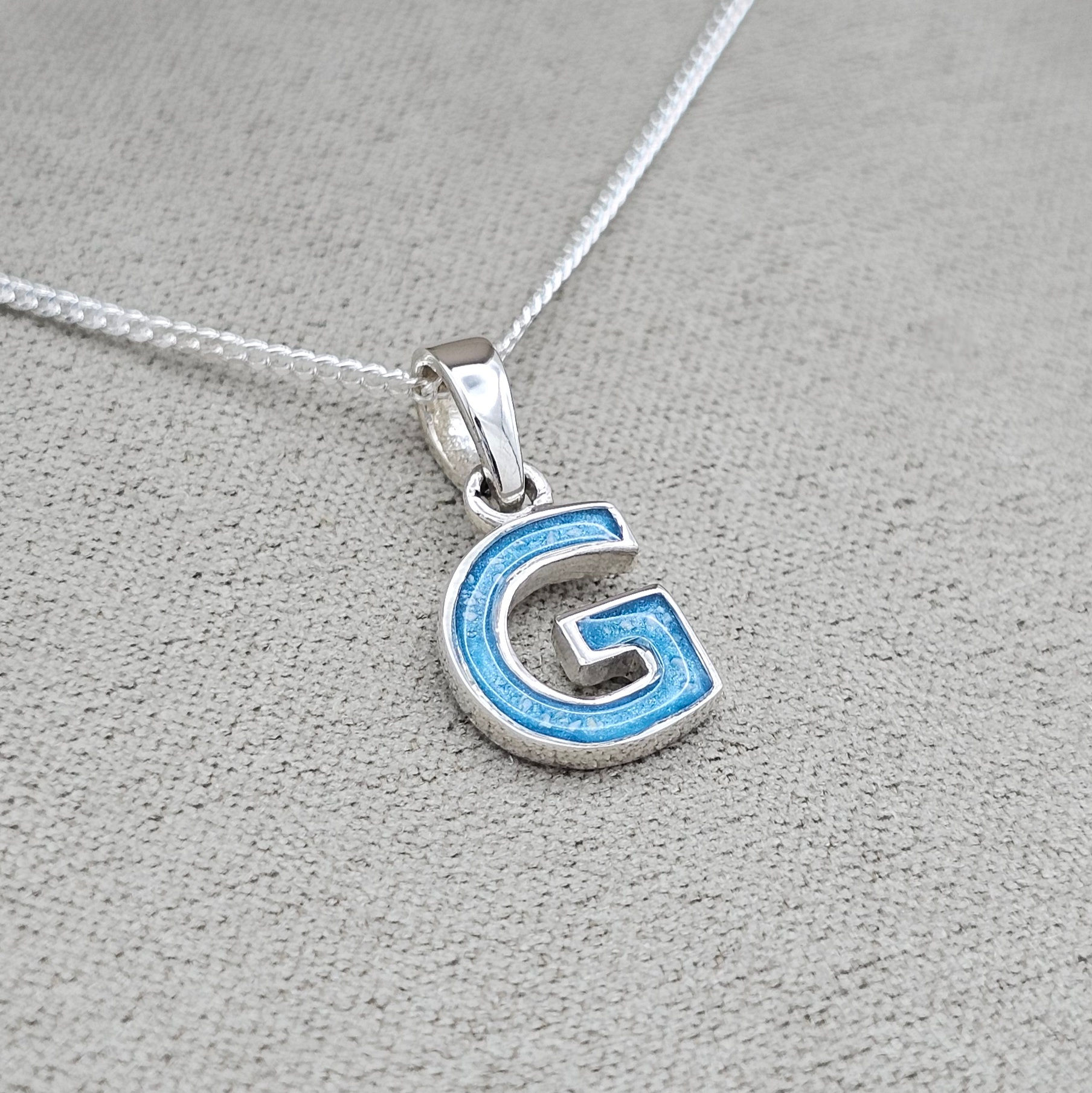 Initial pendant/necklace in sterling silver, suitable for cremation ashes, hair or for use as a memorial keepsake.