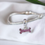 Thumbnail: Dog bone bracelet bead charm in sterling silver, suitable for cremation ashes, hair or for use as a memorial keepsake.
