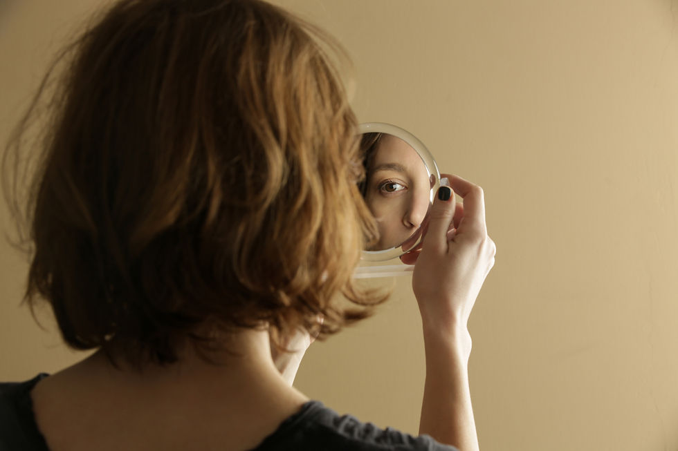 Woman looking at her reflection