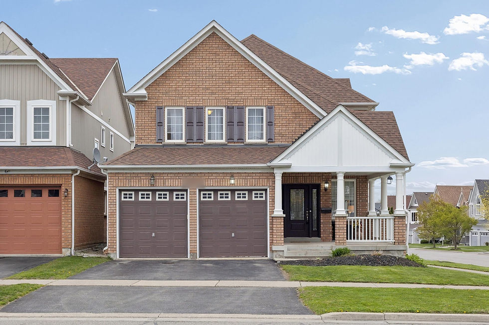 Brick two-storey home with covered front porch and double garage, Arborwood Drive, Taunton, Oshawa