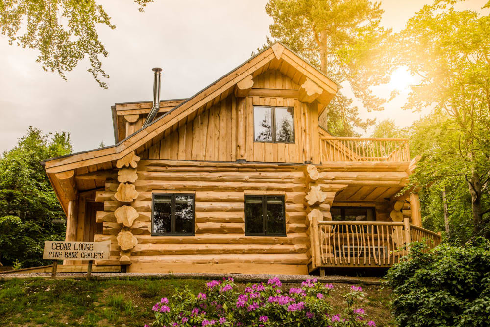 A log cabin in the evening sun