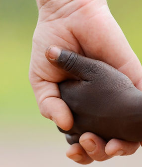 beautiful-peace-symbol-white-woman-black-child-holding-hands-picture-id490399996 (2).jpg