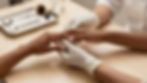 Nail technician performing a nail service.