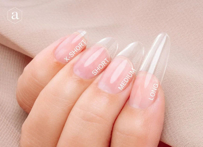 Hand with clear artificial nails labeled X-Short, Short, Medium, Long