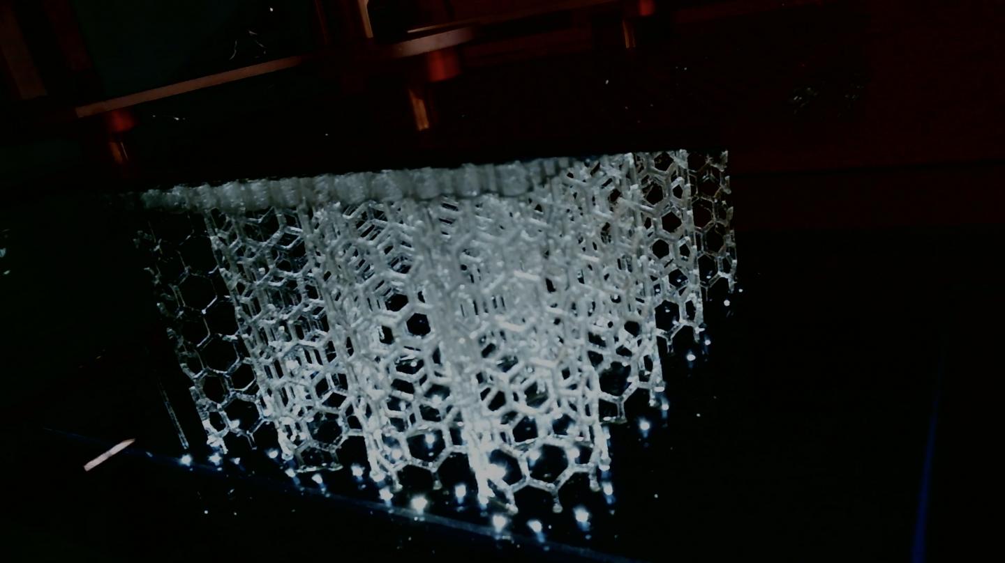 High-area rapid printing technology prints vertically, using ultraviolet light to cure liquid resin into hardened plastic. @ Northwestern University