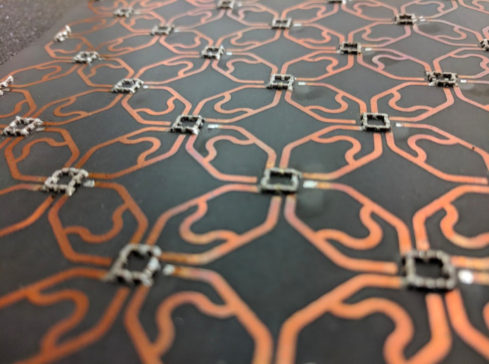 Photograph of the 4-fold symmetric topological circuit used in this study. @ Christopher Peterson, Grainger Engineering