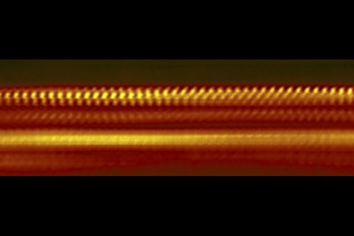 This greatly magnified image shows four layers of atomically thin materials that form a heat-shield just two to three nanometers thick, or roughly 50,000 times thinner than a sheet of paper. @ National Institute of Standards and Technology