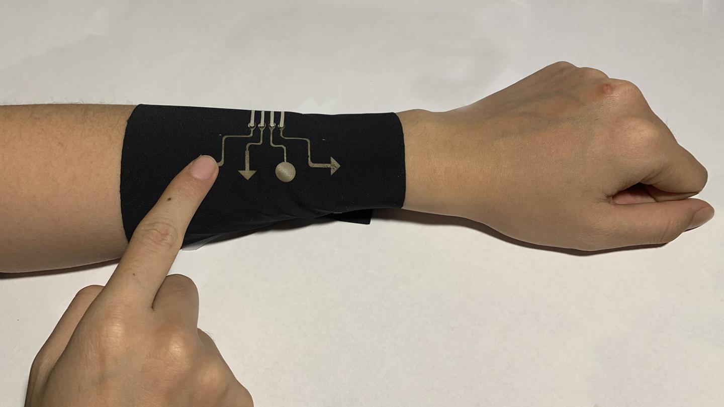 The sleeve pictured here incorporates breathable electronic fabric making it both comfortable and able to function as a video game controller. @ Yong Zhu, NC State University