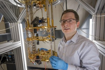Physics researcher Ilya Sochnikov next to a dilution refrigerator in the Gant Complex on July 16, 2019. @ Sean Flynn/UConn