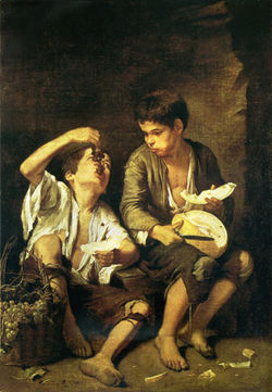 Niños comiendo melón y uvas