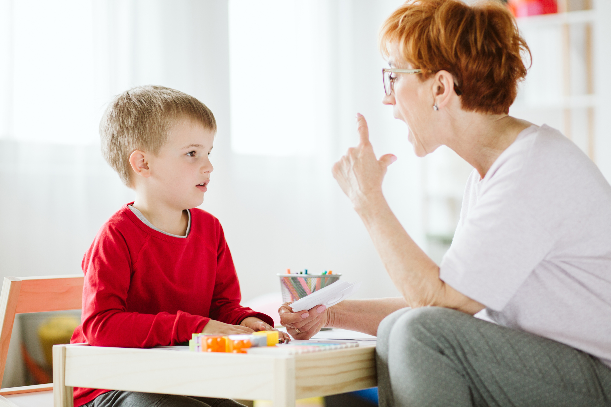 Speech therapist working with a child