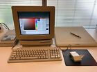 Macintosh LC III with 13" monitor, 12" Wacom tablet and external CD drive.