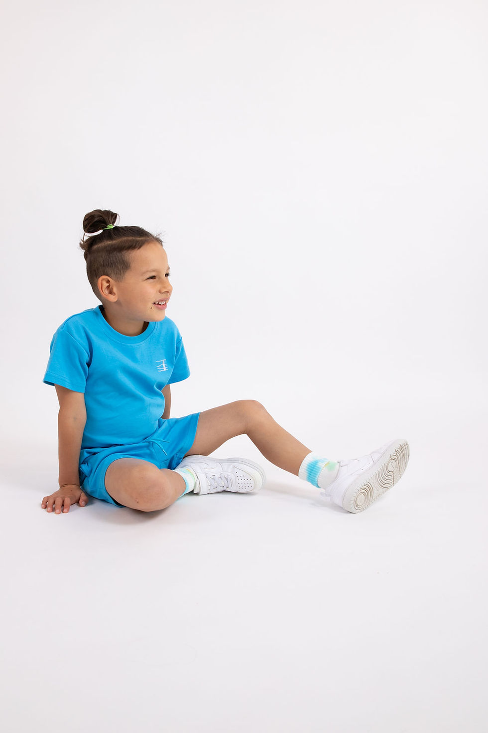 Thumbnail: Boy sitting down wearing blue T-shirt and Bike Short Set