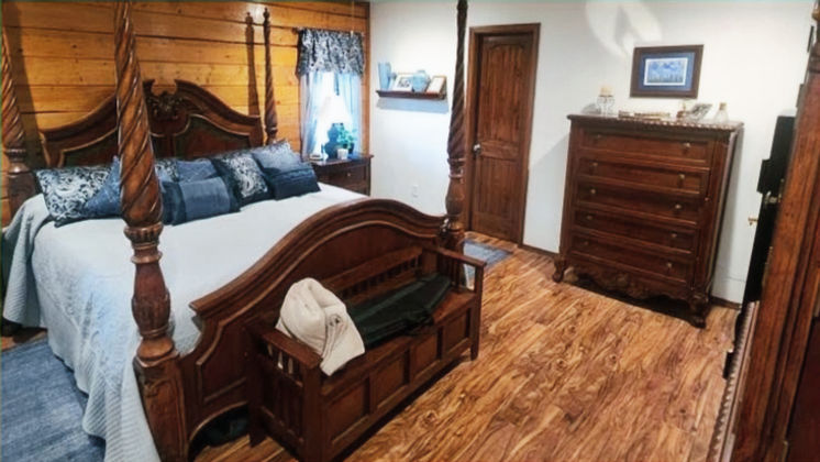 Interior painting and staining project in Mount Pleasant, TX featuring freshly painted walls and professionally stained trim, doors, and woodwork by Divine Layers.