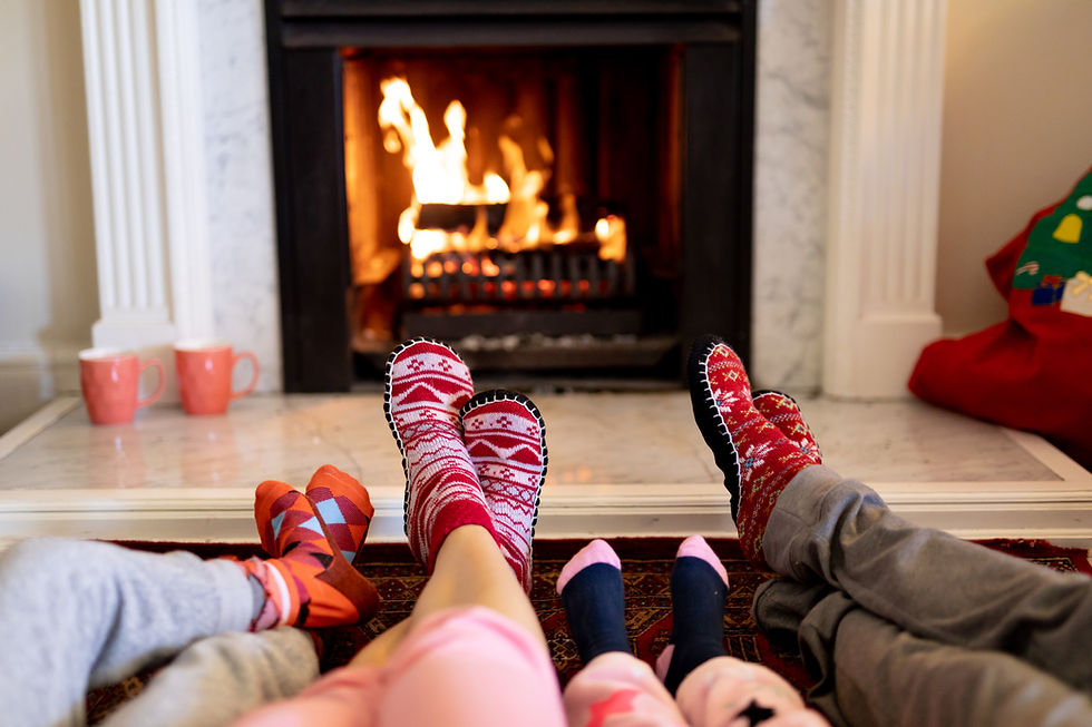 Legs of a Caucasian family lying on the floor, a couple with their young son and daughter