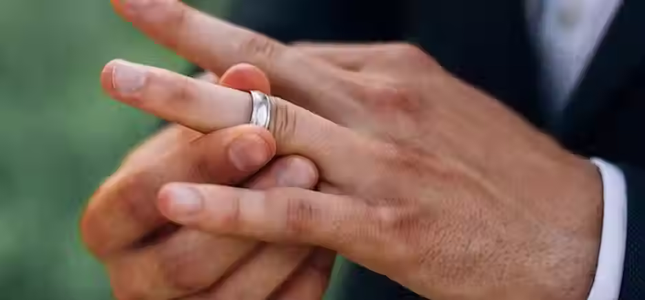 mans-hands-wedding-ring.jpg