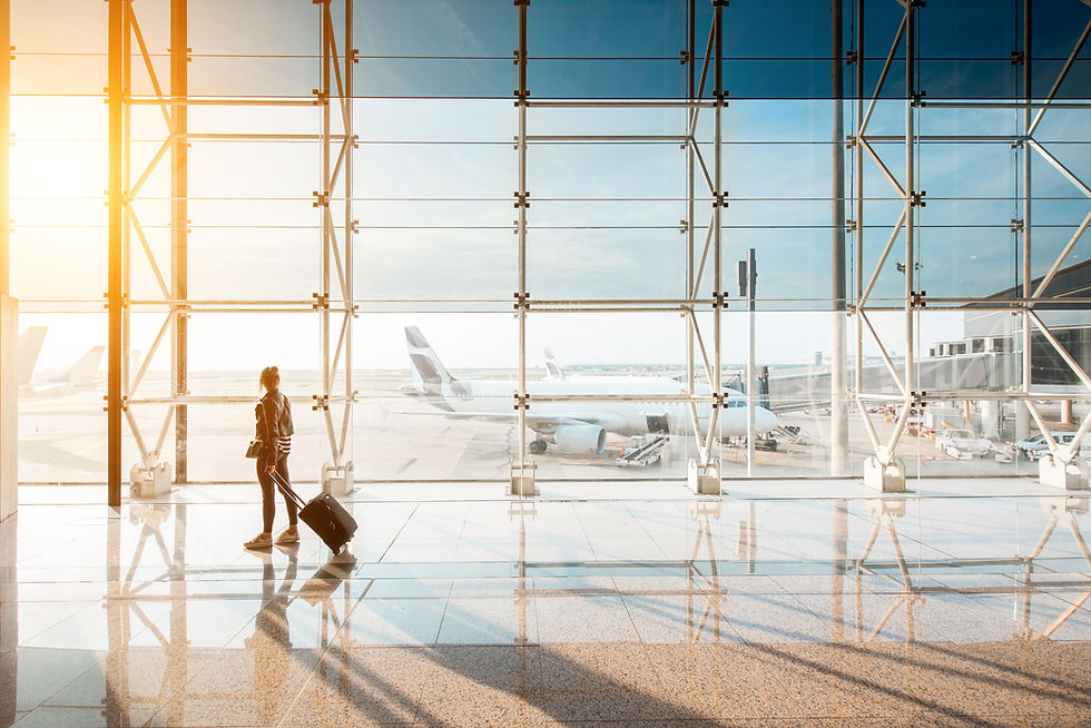 view-aiport-window-with-woman-walking-with-suitcase-departure-hall-sunset-wide-angle-view-