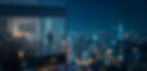 Young business man standing in the 3d rendering office watching the modern city night view