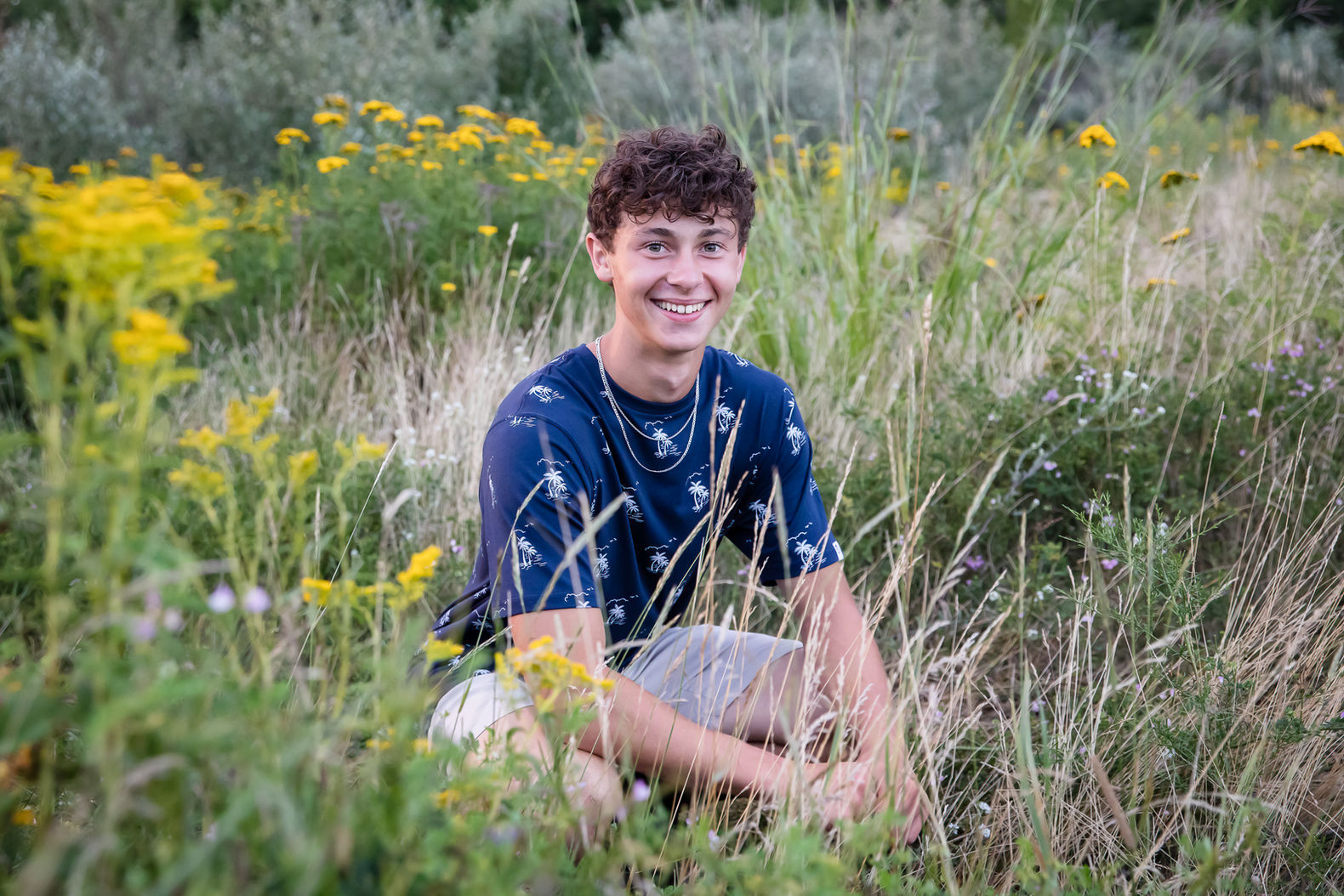 In field. Senior Session Julie Frances Photography in Maine.