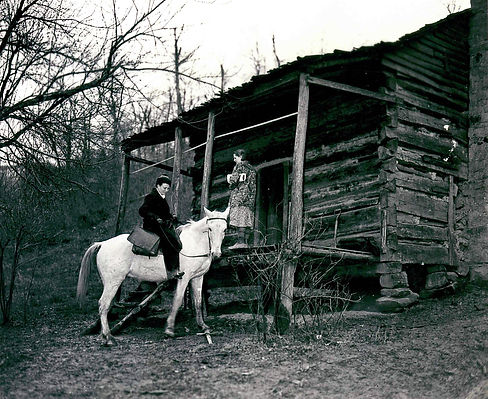 A Pack Horse Librarian delivers books in the hills on her mule.