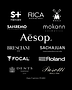 A luxury brand curation index for ÜLRIC atelier lounge, featuring logos for Aesop oral care, Focal audio engineering, Roland digital instruments, Sanremo coffee machines, Bresciani 1970 Italian socks, Dents driving gloves, Pasotti luxury umbrellas, S+ Haircare, Rica, Mühle, Mokann Cosmetics, and Sachajuan