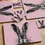 Thumbnail: Melamine table mat with a print of a hand-drawn illustrated hare on a pink background.