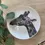 Thumbnail: Ceramic bone china 20cm coupe plate, made in the UK, featuring a decal print of a hand-drawn illustrated giraffe.