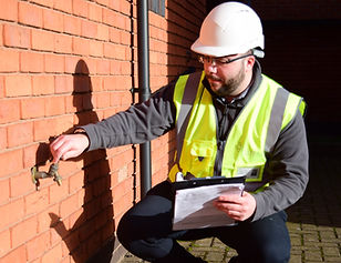 ISHEM employee running an outdoor tap