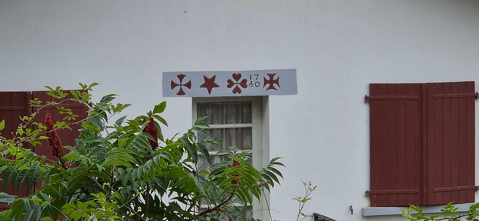 A Basque thing, I think. Markings over the door in this case show that the building is from 1730.