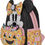 Thumbnail: Angled view of Minnie Mouse pumpkin Loungefly backpack with glow-in-the-dark face and candy corn-scented design
