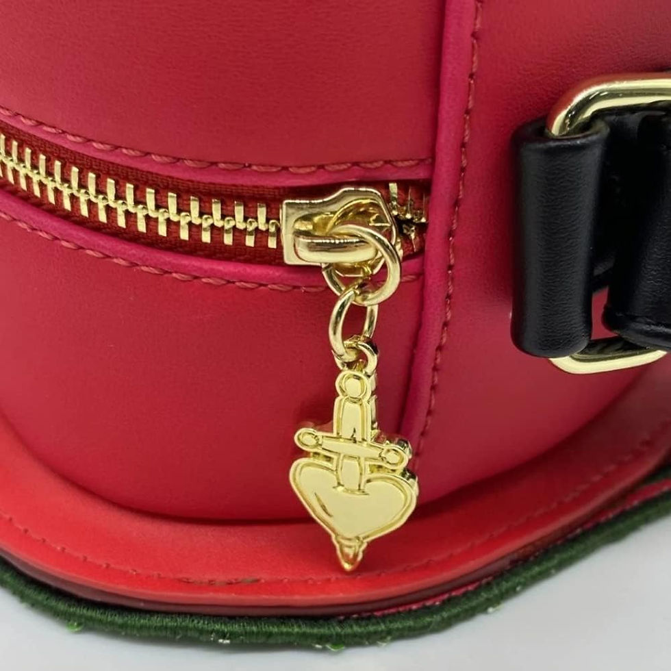 Thumbnail: Close-up of gold dagger heart zipper pull inspired by Evil Queen’s box from Snow White