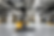 Blurred forklift moves quickly in a large, organized warehouse with shelves of boxes. Bright lighting and industrial setting convey efficiency.
