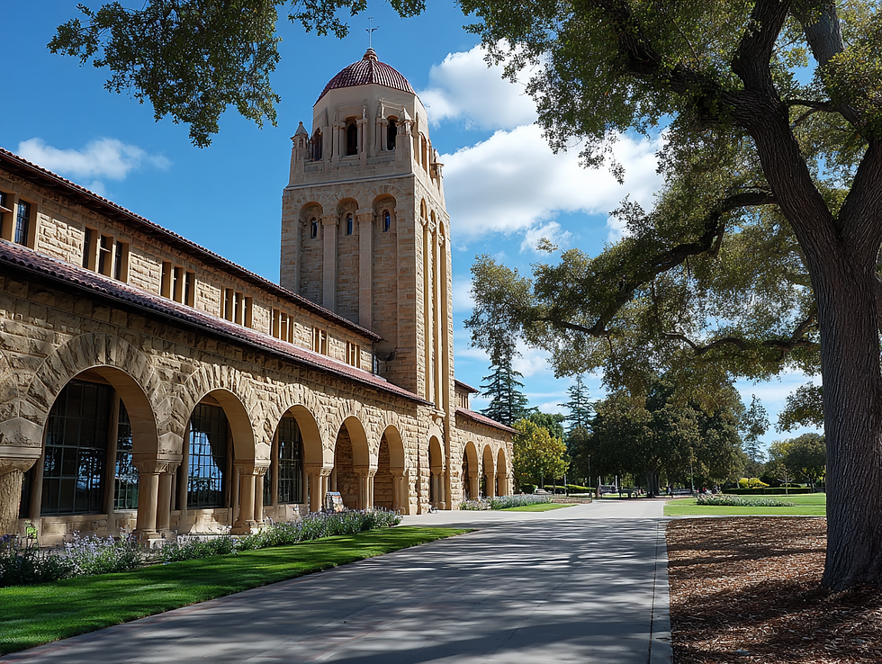 Stone building with arched windows and a tall tower under a blue sky. Trees and greenery surround the peaceful setting.