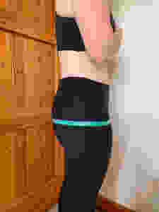 female tape measurement of hips (bum) at widest part of glutes