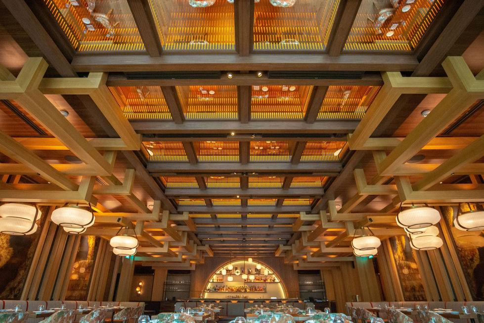 The main dining room features a captivating ceiling installation by contemporary Japanese artist Jun Inoue, adding a final touch of artistic expression to the space.