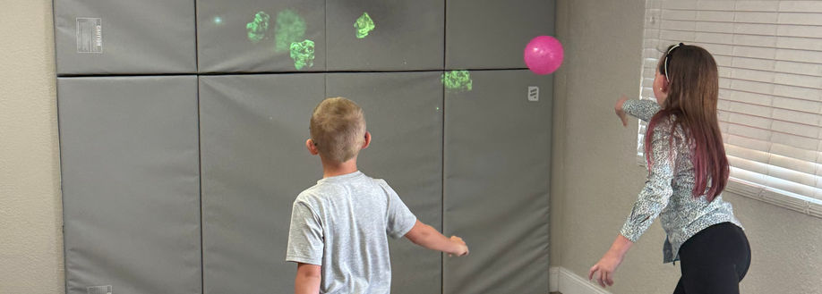 kids playing with game wall