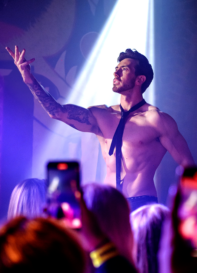 Andy McGuire performing centre stage during Million Dollar Men Live touring male revue production
