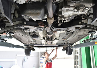 Underside of a vehicle being treated with Lanoguard underbody protection to help guard against corrosion.
