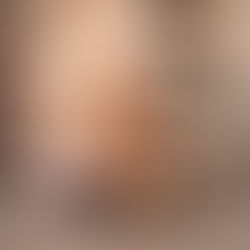 Close-up view of a person practicing deep backbend yoga pose in a serene yoga studio