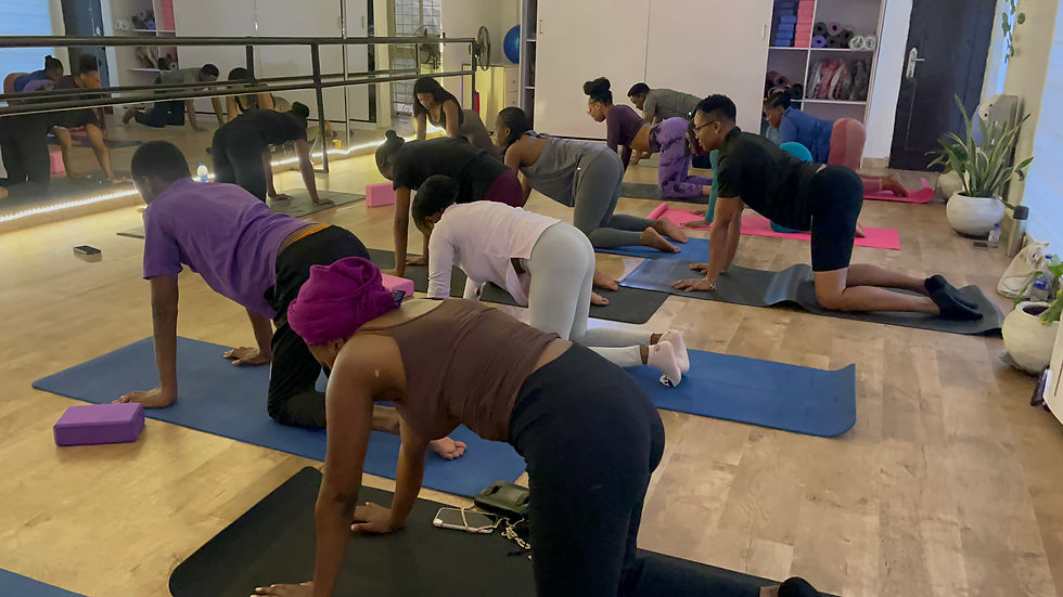 High angle view of a Yoga class practicing flexibility and breathing exercises