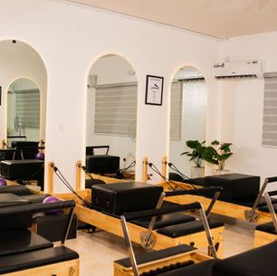 Eye-level view of a Pilates reformer machine with resistance springs