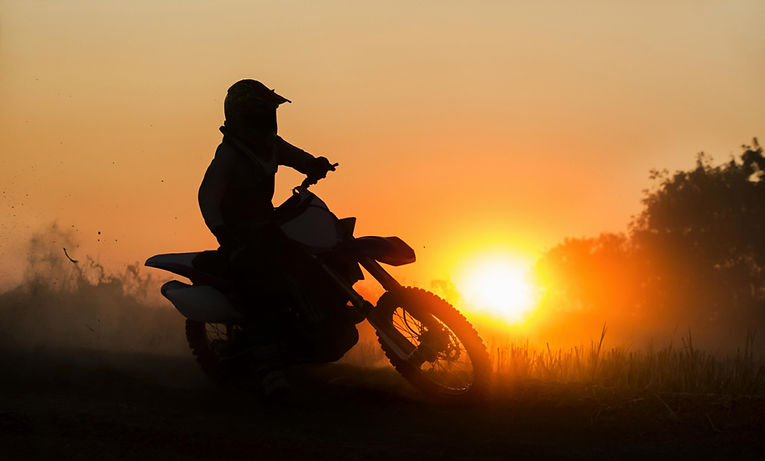 Dirt biker silhouette at sunset